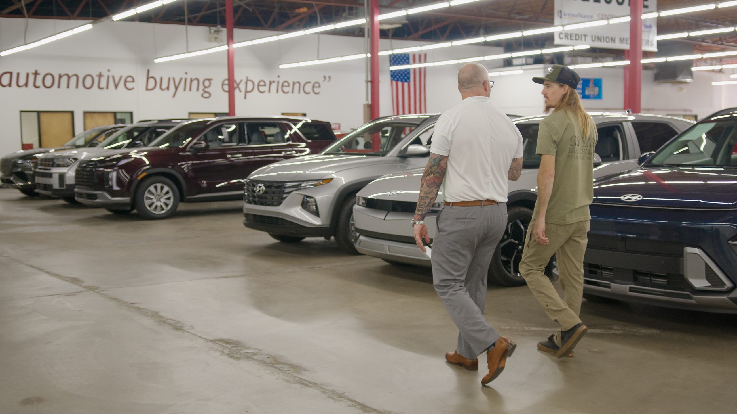 men looking at used trucks for sale